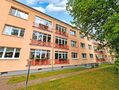 makellos 12 ETW Reutershagen - Hausrückseite.jpg